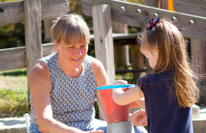 teacher and child, sandbox